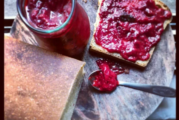 a jar of strawberry-mint jam and home made mread.
